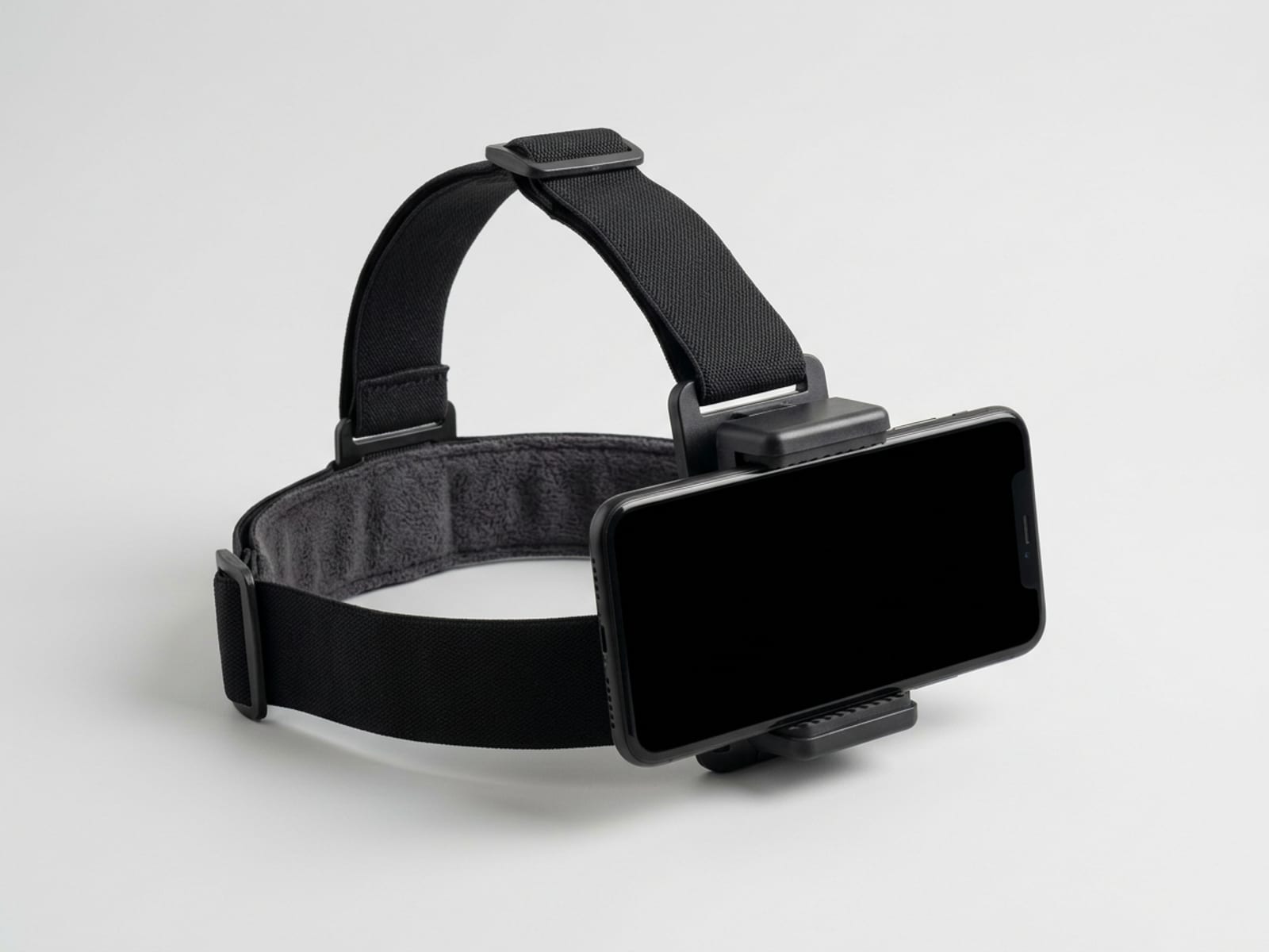 Adjustable black elastic head strap with a phone clamp at the forehead holding a smartphone in landscape